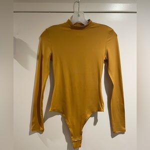 Mustard colored long sleeve leotard